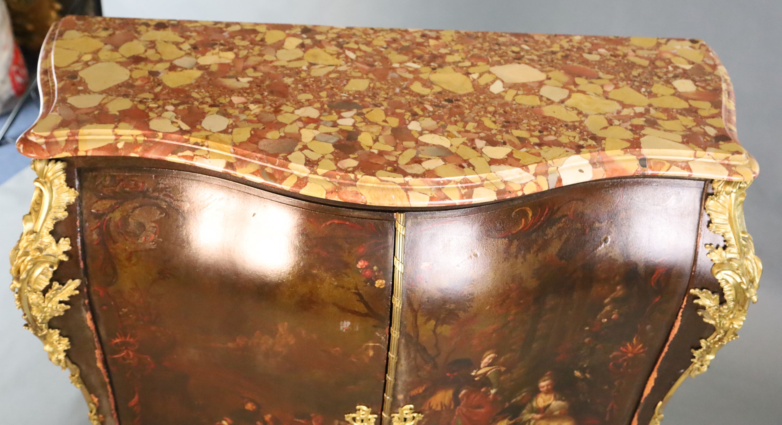 A late 19th century Louis XVI style serpentine bombe commode, W.4ft D.1ft 8in. H.4ft 3in.